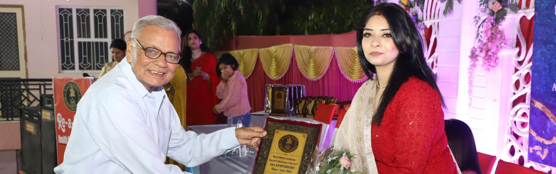 Pallavi Raghuwanshi receiving the Re-a-Ninex Institute 20th Anniversary Health, Wellness & Fitness honor